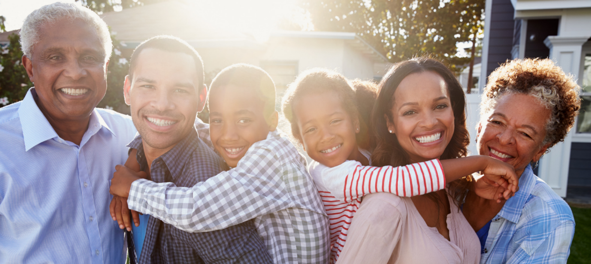 photo of happy, smiling adults and children, and grandchildren. 